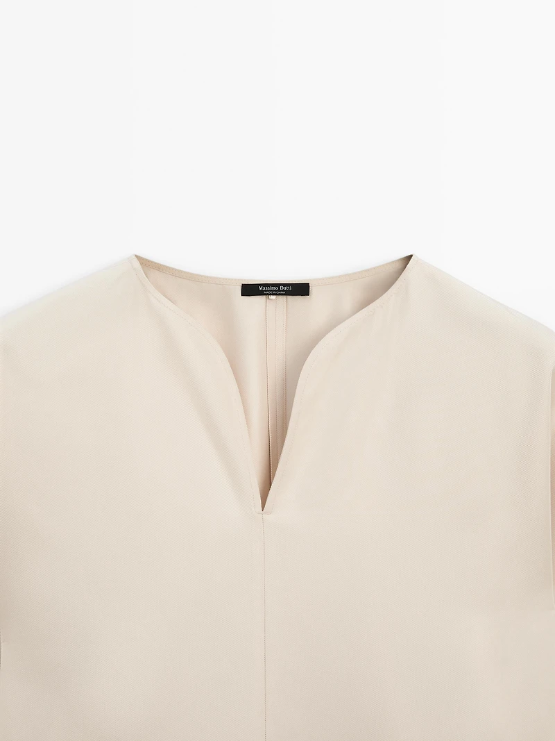 Flowing blouse with slit details
