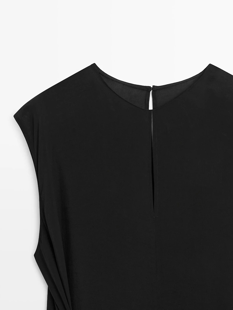 Flowing jumpsuit with knot detail