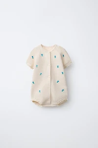EMBROIDERED FLORAL TEXTURED ROMPER WITH LACE TRIM