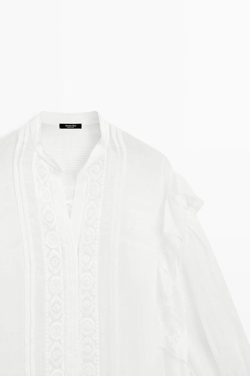 Stand collar blouse with embroidery and ruffles