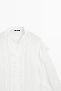 Stand collar blouse with embroidery and ruffles