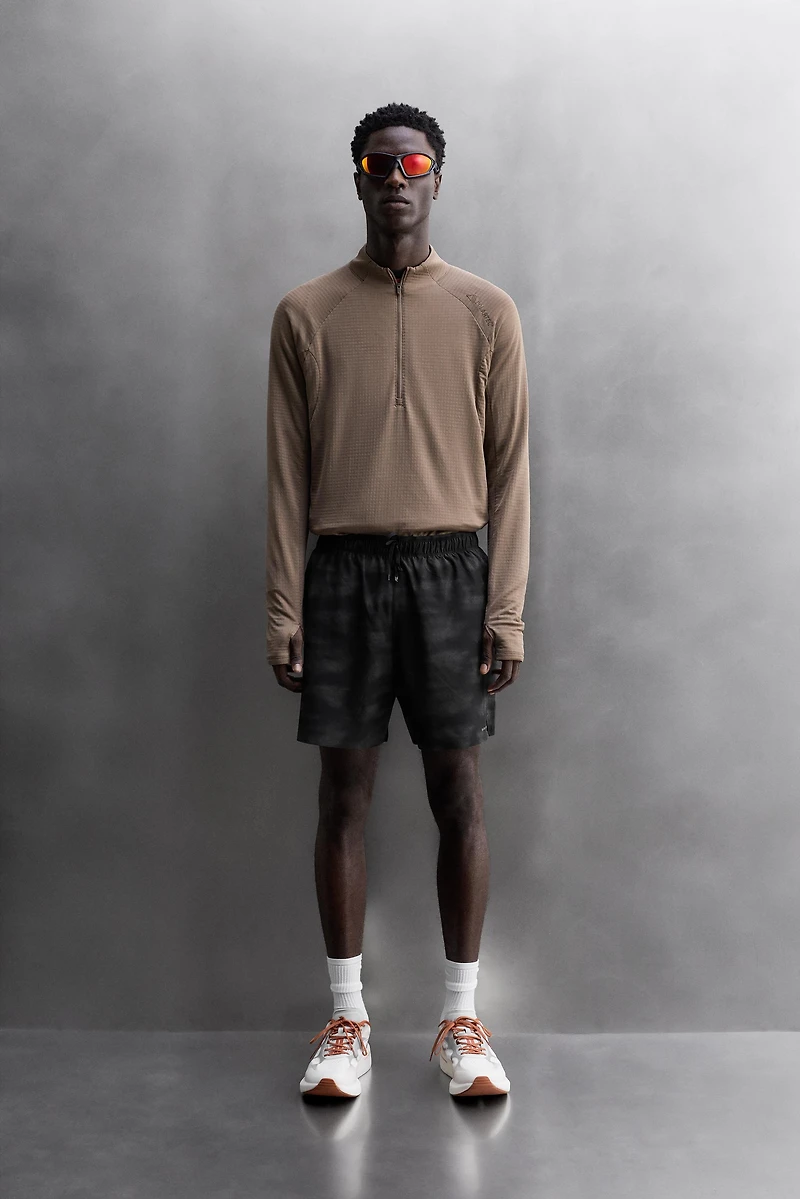 PERFORATED RUNNING SHORTS