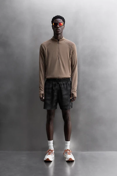 PERFORATED RUNNING SHORTS