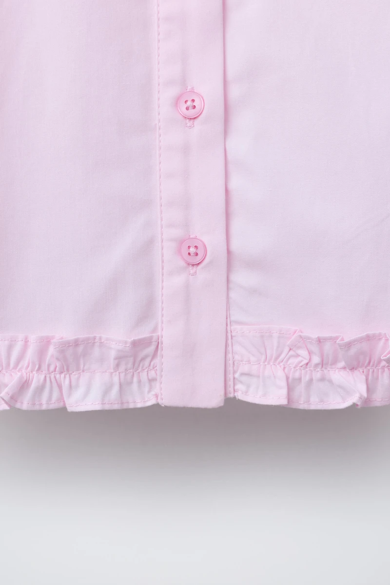 RUFFLED HEM SHIRT