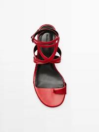 Leather sandals with criss-cross straps