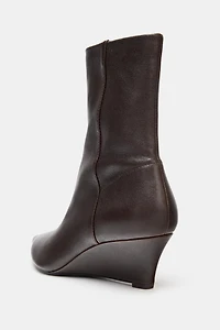 BOTTINES EN CUIR À TALONS COMPENSÉS