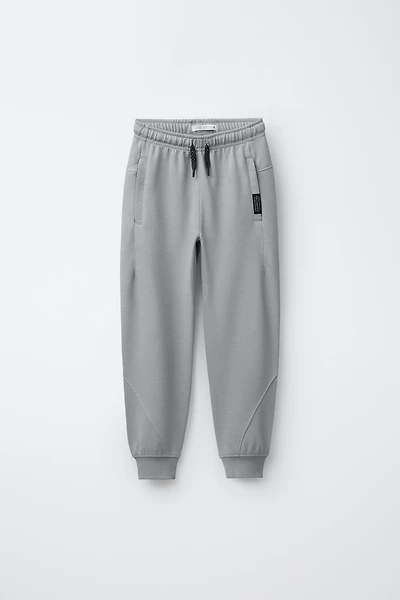 PANTALON EN MOLLETON INTERLOCK ET PIQUÉ