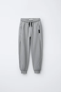 PANTALON EN MOLLETON INTERLOCK ET PIQUÉ
