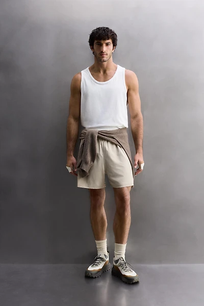 COMBINED PERFORATED SHORTS