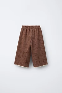 PANTALON EN MOLLETON JUPE-CULOTTE IMPRIMÉ DENTELLE