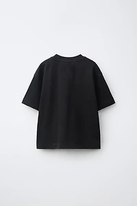 T-SHIRT EFFET DÉLAVÉ À POCHE ET ÉTIQUETTE