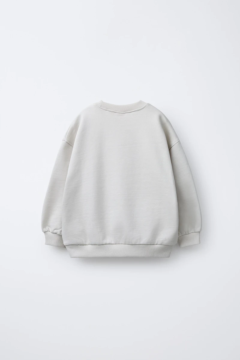 SWEAT IMPRIMÉ NIRVANA ® IRISÉ