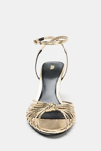 METALLIC KNOTTED HEELED SANDALS