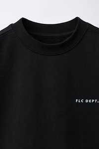 SHORT SLEEVE RAISED TEXT SWEATSHIRT