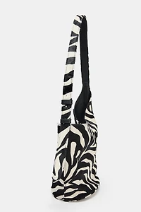 MINI SAC SEAU SOUPLE EN CUIR ASYMÉTRIQUE