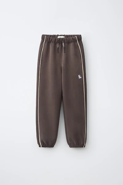 SPORTY CONTRAST PIPING TROUSERS