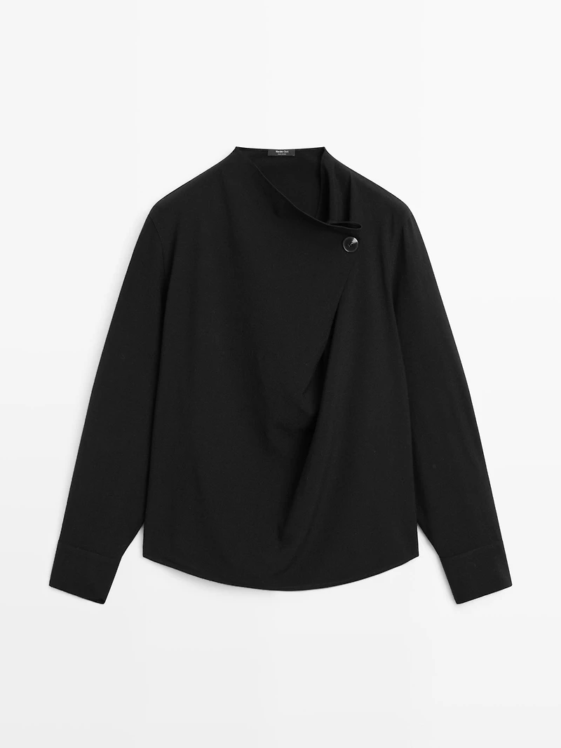 Blouse with crossover detail and button