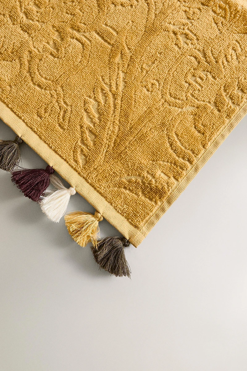 SERVIETTE DE BAIN POMPONS JACQUARD