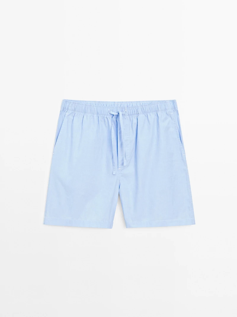 Short sleeve pyjama top and striped trousers