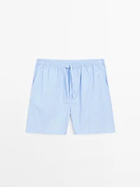 Short sleeve pyjama top and striped trousers