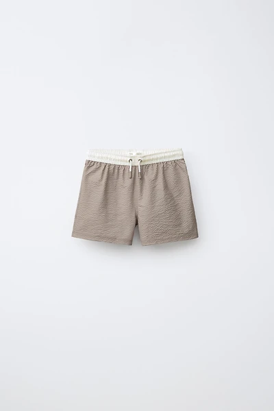 AGES 6-14 / LABEL SWIM SHORTS