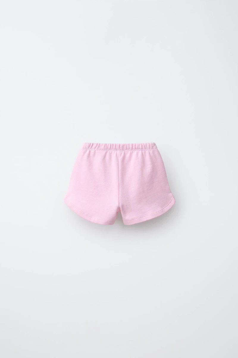 LOT DE DEUX BERMUDAS CERISES ET ONDULATIONS