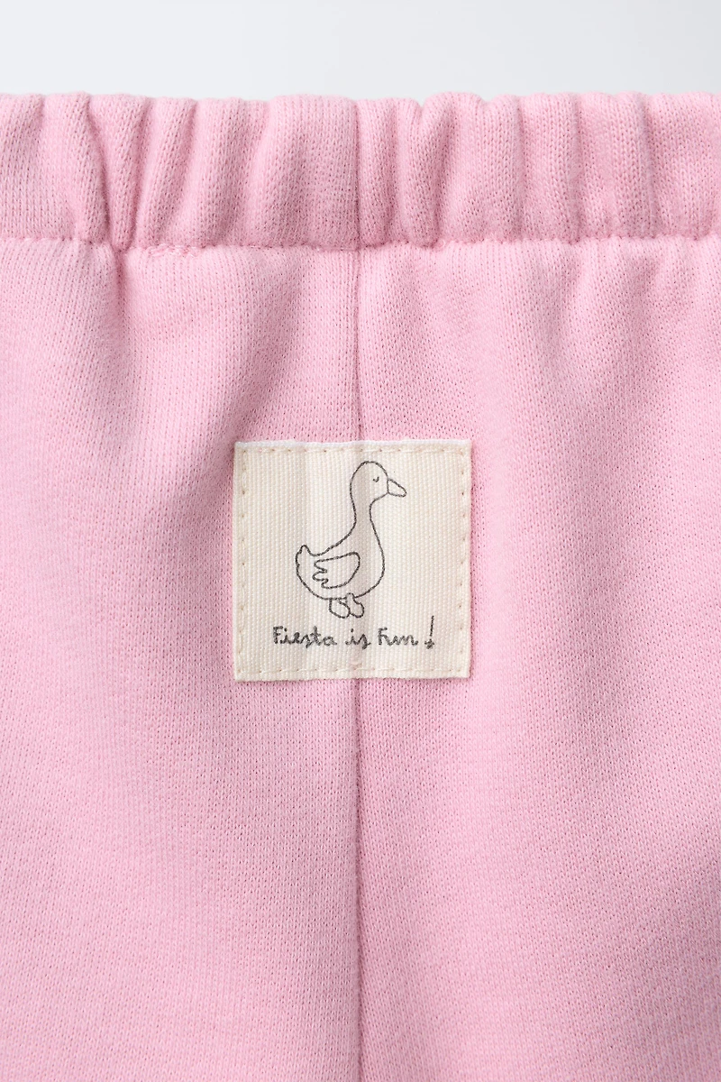 PANTALON EN MOLLETON BAGGY AVEC ÉTIQUETTE