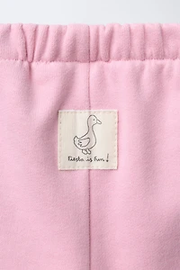 PANTALON EN MOLLETON BAGGY AVEC ÉTIQUETTE