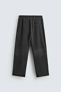 PANTALON RELAXED FIT CLOUS MATIÈRE SYNTHÉTIQUE