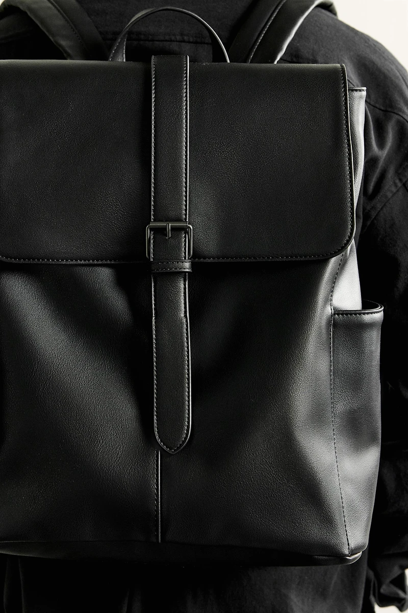 BELTED FLAP BACKPACK