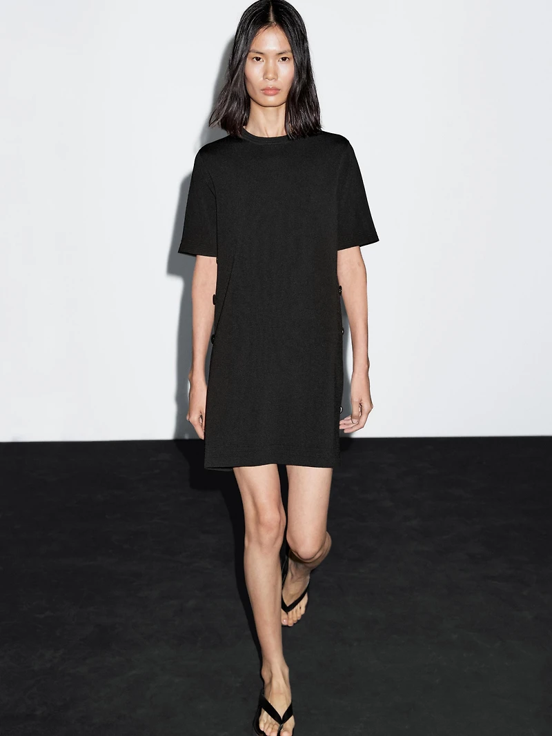 Short knit dress with side button details