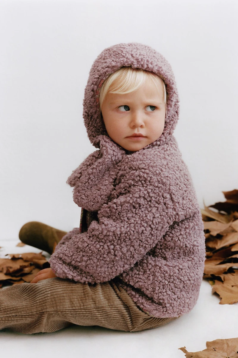 FLEECE HAT WITH NECK DETAIL