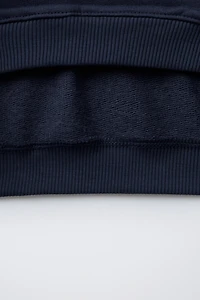 SWEAT BASIQUE À INSCRIPTION