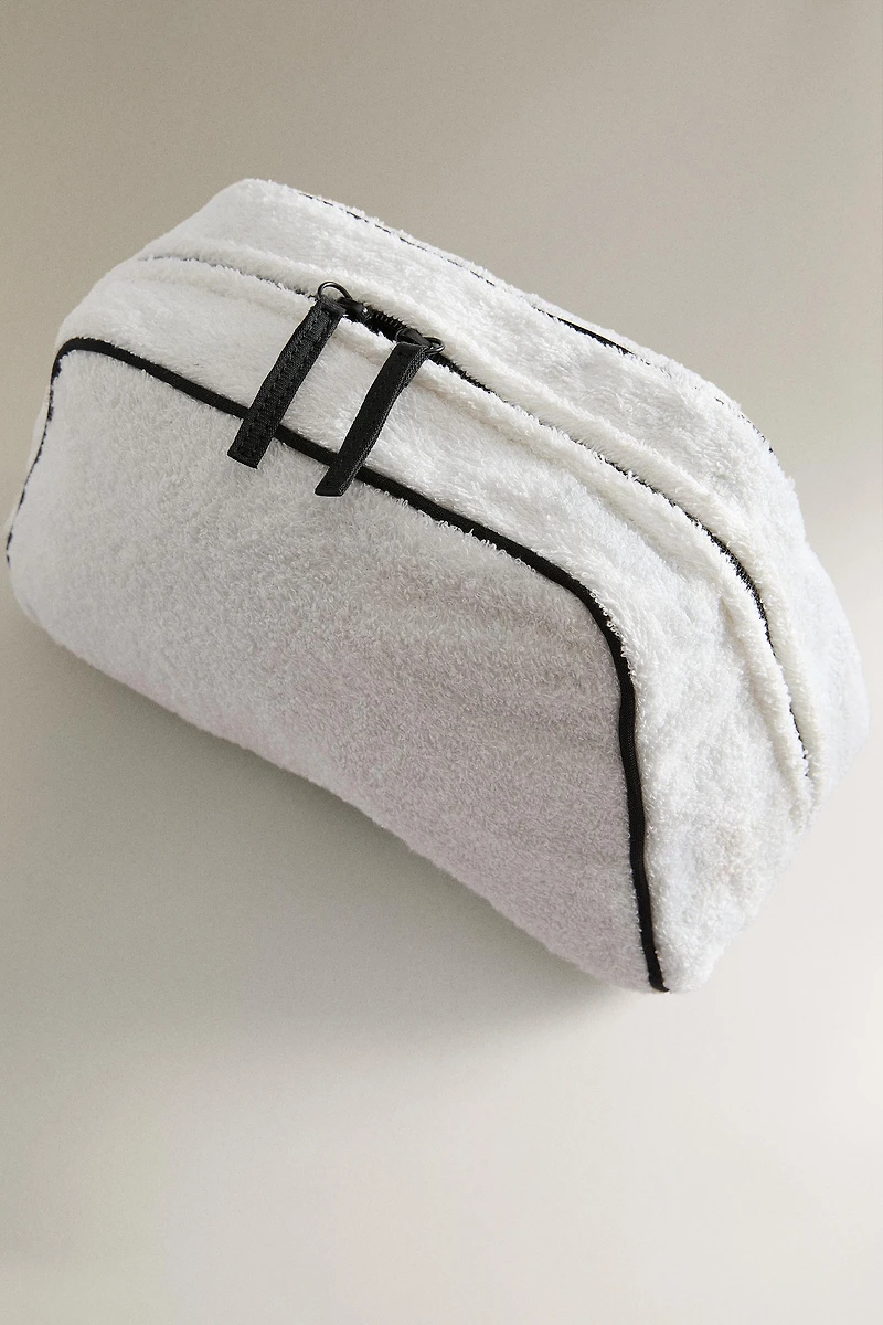 TERRY CLOTH TOILETRY BAG WITH PIPING DETAIL