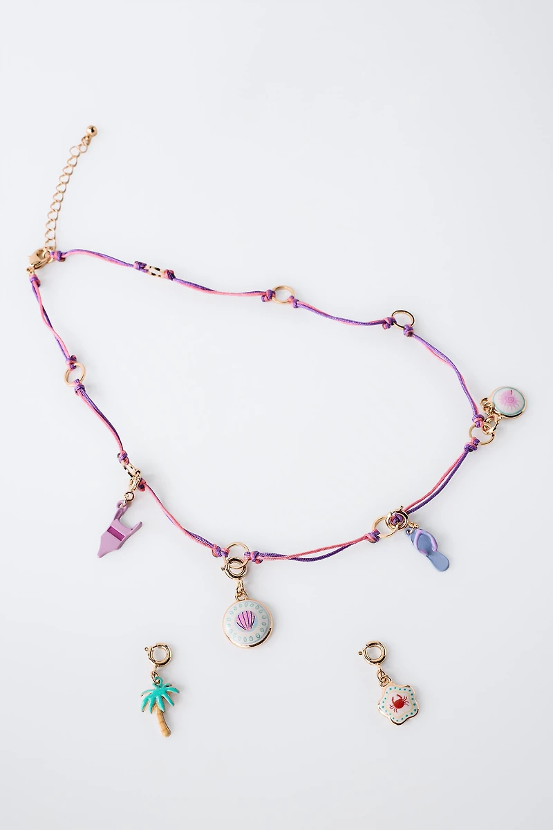 INTERCHANGEABLE MULTI-CHARM NECKLACE
