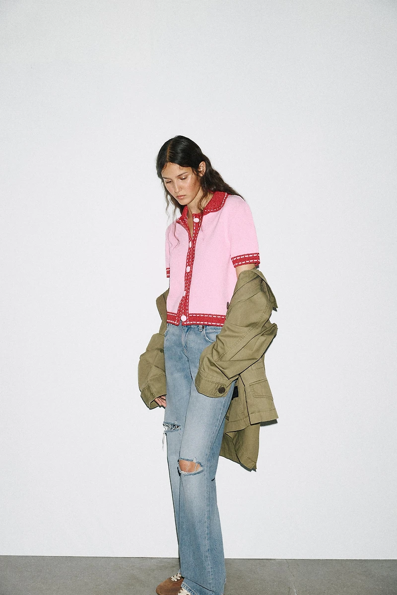 VESTE EN MAILLE SURPIQÛRES MANCHES COURTES