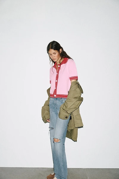 VESTE EN MAILLE SURPIQÛRES MANCHES COURTES