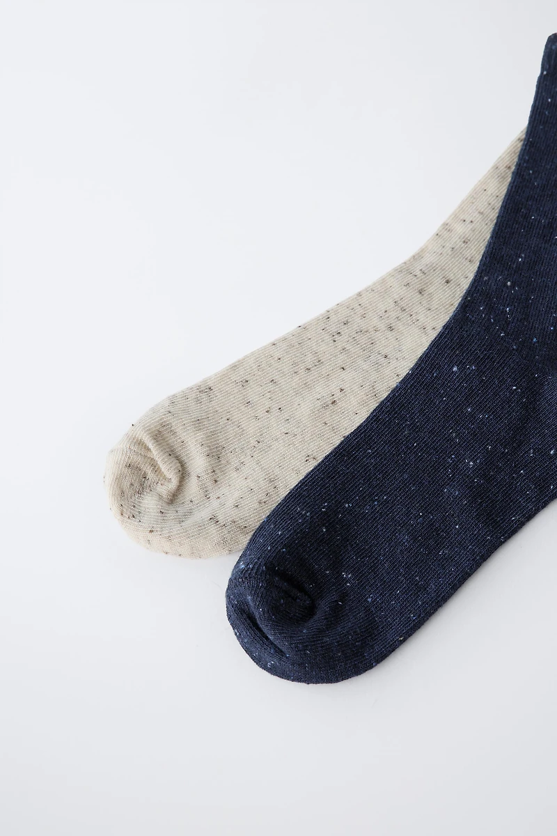 TWO-PACK OF LONG BUTTON-PRINT SOCKS