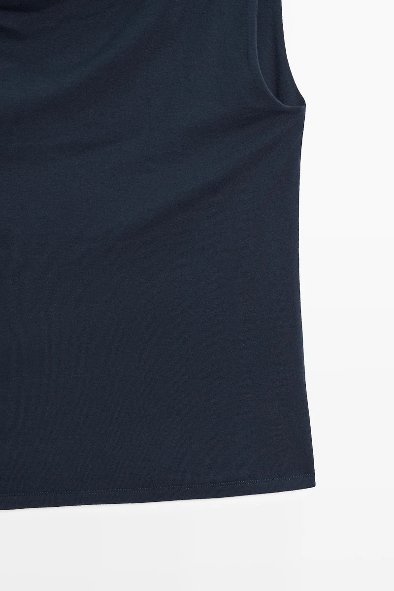 Asymmetric drop sleeve top