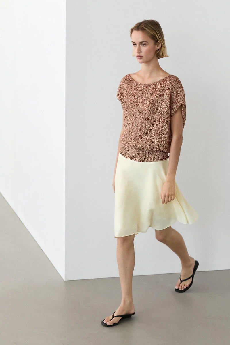 Cotton blend knit top with ribbed hem