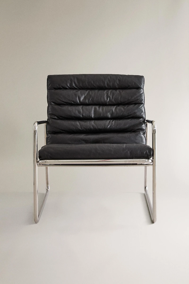 LEATHER AND STAINLESS STEEL ACCENT CHAIR