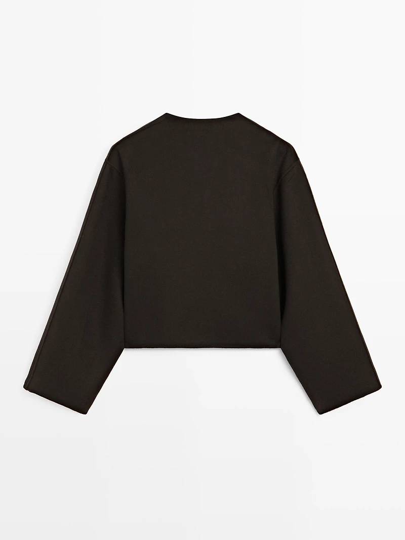 Short coat with rounded lapels