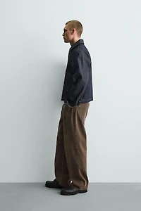 RELAXED FIT JEANS WITH WAXED EFFECT FINISH