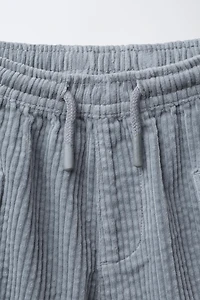 PANTALON EN VELOURS CÔTELÉ À POCHES
