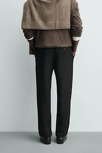 TEXTURED PLEATED PANTS