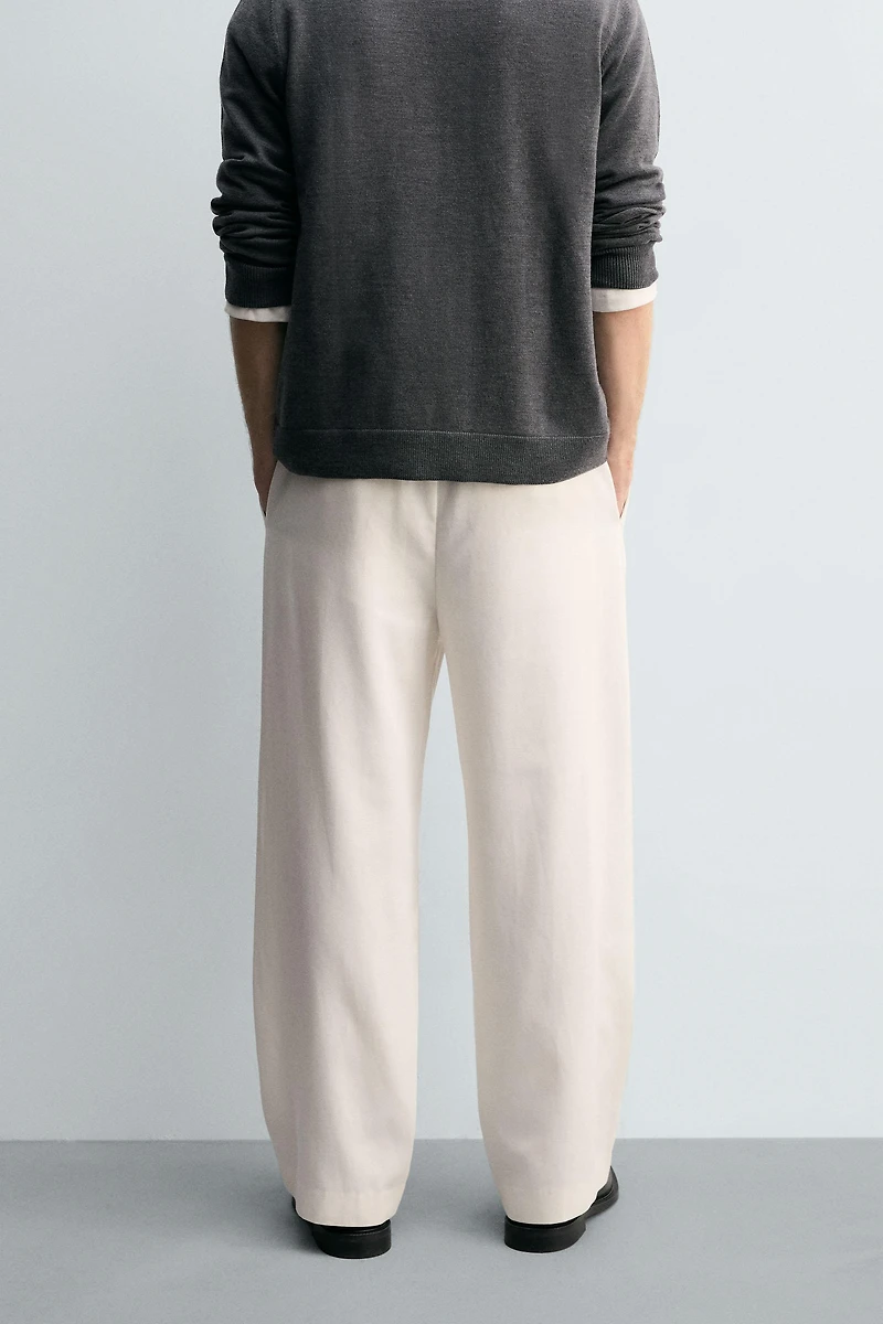 TEXTURED PLEATED PANTS