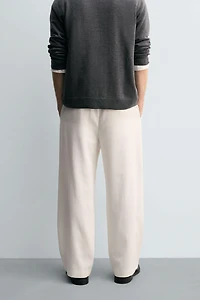 TEXTURED PLEATED PANTS