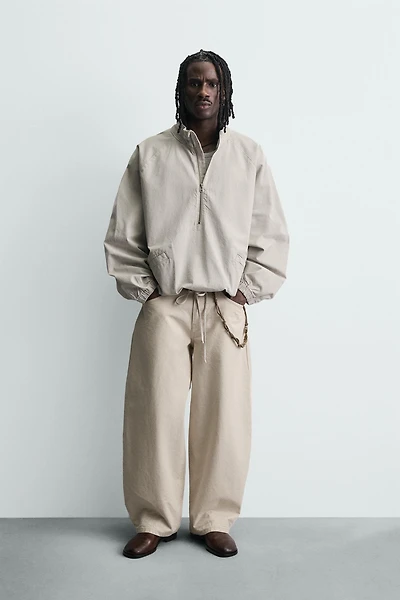 ZIPPERED POUCH POCKET SWEATSHIRT