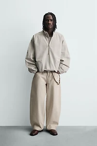 ZIPPERED POUCH POCKET SWEATSHIRT