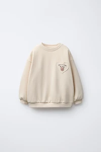 HEART POCKET SWEATSHIRT